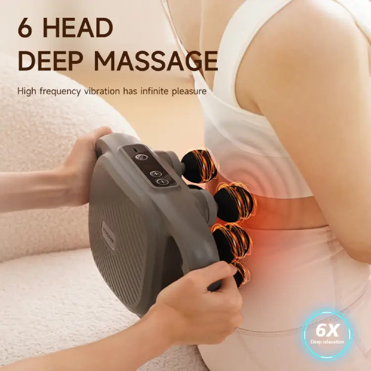 Person using massage gun on back muscles